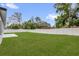 Expansive backyard with lush green grass and a privacy fence, perfect for outdoor activities at 494 Marion Oaks Trl, Ocala, FL 34473