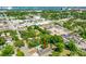 Aerial view of a property highlighting the house, surroundings, and cityscape in the distance at 535 Madison Ave, Daytona Beach, FL 32114