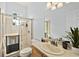 Bright bathroom featuring a glass enclosed shower and white sink with a large vanity mirror at 535 Madison Ave, Daytona Beach, FL 32114