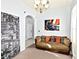 Cozy living room featuring comfortable sofa, neutral walls, chandelier, and stylish decor at 535 Madison Ave, Daytona Beach, FL 32114