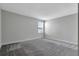 Inviting bedroom with natural light filtering through the window and neutral wall color at 11357 Satire St, Orlando, FL 32832