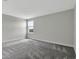 Bright bedroom with natural light filtering through the window and neutral wall color at 11357 Satire St, Orlando, FL 32832