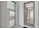 Inviting entryway featuring an open doorway with ceramic tile flooring leading into the home's interior at 11357 Satire St, Orlando, FL 32832