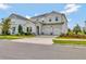 Charming two-story home with a three car garage, manicured landscaping, and an inviting front entrance at 11357 Satire St, Orlando, FL 32832