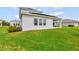 Backyard exterior showcasing a well-maintained lawn at 11357 Satire St, Orlando, FL 32832