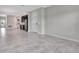 Spacious open-concept living space with tile flooring, neutral paint, and lots of natural light at 11357 Satire St, Orlando, FL 32832