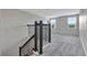 Stairway featuring wrought iron spindles and leading to a large, carpeted area at 11357 Satire St, Orlando, FL 32832
