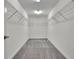 Spacious walk-in closet with carpeted flooring and ample shelving for optimal organization at 11357 Satire St, Orlando, FL 32832