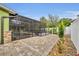 A screen-enclosed pool area with a stone patio, offering a private outdoor space at 3136 Heartleaf Pl, Winter Park, FL 32792