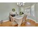 Dining room with natural light, hardwood floors, and decorative chandelier at 3136 Heartleaf Pl, Winter Park, FL 32792