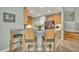Kitchen with stainless steel appliances, light wood cabinets, and granite countertops at 3136 Heartleaf Pl, Winter Park, FL 32792
