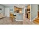 Kitchen featuring stainless appliances, a center island with barstool seating, and tile flooring at 3136 Heartleaf Pl, Winter Park, FL 32792