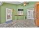 This patio features a sink, skylight, ceiling fan, and doors with shutter-style blinds at 3136 Heartleaf Pl, Winter Park, FL 32792