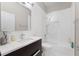 An updated bathroom with a custom vanity and glass shower at 8704 Crestgate Cir, Orlando, FL 32819