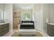A luxurious Primary bath features a soaking tub and separate shower at 8704 Crestgate Cir, Orlando, FL 32819