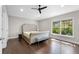 A bright bedroom with hardwood floors and a large window at 8704 Crestgate Cir, Orlando, FL 32819