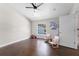 Charming bonus room with a ceiling fan, wood floors, natural light, and cute decor at 8704 Crestgate Cir, Orlando, FL 32819
