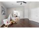 This bonus room boasts great natural light, hardwood flooring, and decor perfect for a playroom or Bedroom at 8704 Crestgate Cir, Orlando, FL 32819