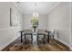 This dining room features neutral colors and a modern light fixture at 8704 Crestgate Cir, Orlando, FL 32819