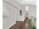 Hallway with hardwood floors, recessed lighting, and a golf putting practice area at 8704 Crestgate Cir, Orlando, FL 32819