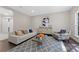 The cozy living room features stylish furnishings, a modern art piece, and plenty of natural light at 8704 Crestgate Cir, Orlando, FL 32819