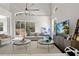 Bright living room with high ceilings and sliding glass doors leading to the patio at 8704 Crestgate Cir, Orlando, FL 32819