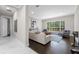 Inviting living room featuring hardwood floors, large window, and neutral decor at 8704 Crestgate Cir, Orlando, FL 32819