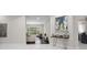 Bright living room with large windows, dark wood floors and stylish decor at 8704 Crestgate Cir, Orlando, FL 32819