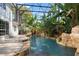 Outdoor pool with lush landscaping at 8704 Crestgate Cir, Orlando, FL 32819