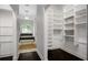 An ample walk-in closet is conveniently located near the bathroom at 8704 Crestgate Cir, Orlando, FL 32819