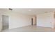Spacious living area with tile flooring, neutral walls, and multiple doorways at 3106 Windswept, Wildwood, FL 34785