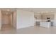 Open-concept living space with tile floors, modern gray kitchen and bright, natural light at 3106 Windswept, Wildwood, FL 34785