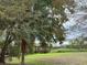 Wooden boardwalk surrounded by lush greenery, leading to scenic water views at 3612 Julius Estates Blvd, Winter Haven, FL 33881