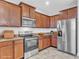 Kitchen features stainless steel appliances and ample wood cabinetry at 3612 Julius Estates Blvd, Winter Haven, FL 33881