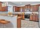 Modern kitchen with stainless steel appliances and wood cabinets at 3612 Julius Estates Blvd, Winter Haven, FL 33881