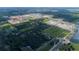 Expansive aerial view of a growing residential development with lakes and landscaping at 5274 Teirgarten St, Saint Cloud, FL 34771