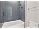 Modern bathroom with a subway-tiled shower and tub combo and sleek fixtures at 1904 Illinois St, Orlando, FL 32803