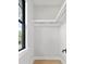 Walk-in closet with white walls and modern shelving for optimal storage at 1904 Illinois St, Orlando, FL 32803