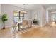 Elegant dining room with hardwood floors, modern chandelier, and large window at 1904 Illinois St, Orlando, FL 32803