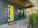 Inviting front entrance featuring a vibrant yellow door, modern house number, and stone walkway at 1904 Illinois St, Orlando, FL 32803