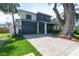 Charming two-story home with a paved driveway, garage, and beautifully landscaped yard at 1904 Illinois St, Orlando, FL 32803