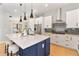 Modern kitchen with stainless steel appliances, a large island, and pendant lighting at 1904 Illinois St, Orlando, FL 32803