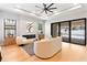 Bright living room features modern fireplace, stylish furniture, and sliding glass doors to the outdoor pool area at 1904 Illinois St, Orlando, FL 32803