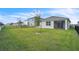 Spacious backyard with grassy area and privacy fence at 5166 Tana Ter, Saint Cloud, FL 34772