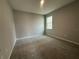 Cozy carpeted bedroom featuring one window at 5310 Teirgarten St, Saint Cloud, FL 34771