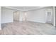 Spacious living room with wood-look tile flooring at 1325 Arklow Cir, Ormond Beach, FL 32174