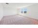 Light-filled bedroom with plush carpeting and double windows at 1449 Arbor Hill Dr, Deltona, FL 32725