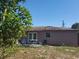 Backyard featuring a patio with outdoor furniture and a view of the home's exterior at 16 N Lancelot Ave, Orlando, FL 32835
