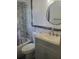Updated bathroom featuring marble tile in the shower and a modern vanity with a round mirror at 16 N Lancelot Ave, Orlando, FL 32835