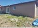 Exterior view of the home showcasing backyard and a durable concrete block construction and backyard with grass at 16 N Lancelot Ave, Orlando, FL 32835